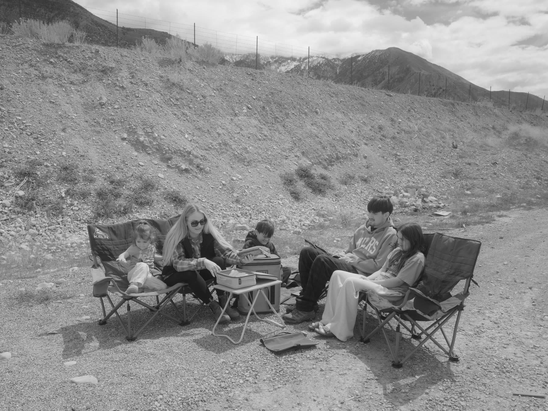 Carlos's family gathered at a mountain trail picnic in Park City
